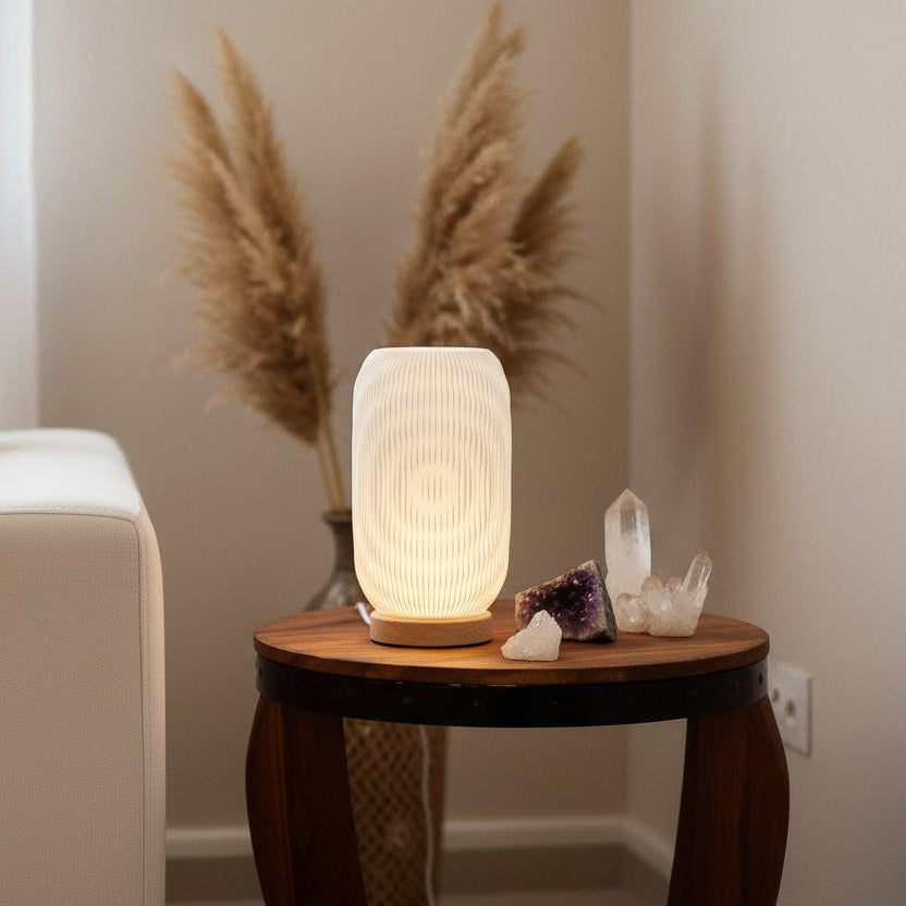 Twisted sculptural USB lamp on wooden base designed for calm interiors