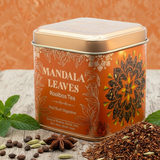 Tin of Rise & Sage Red Bush Digestive Tea with warm orange and gold label, featuring rooibos leaves, fennel seeds, fresh mint, and anise styled for a calming digestive ritual.